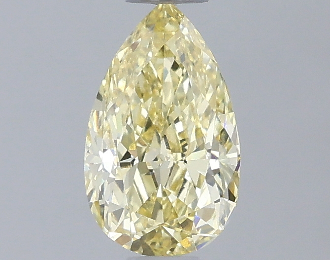 Actual 0.54 carat Fancy Yellow Pear lab-grown diamond