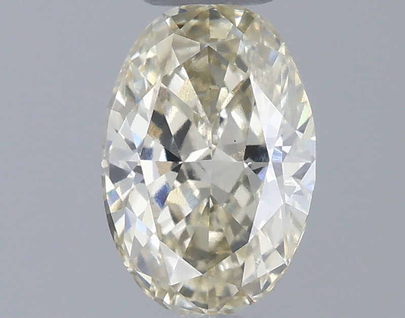 Actual 0.52 carat Fancy Yellow Oval lab-grown diamond
